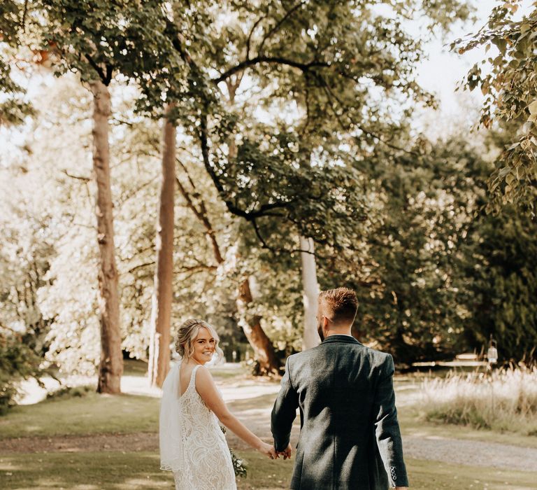 Bride in lace fit and flare wedding dress 