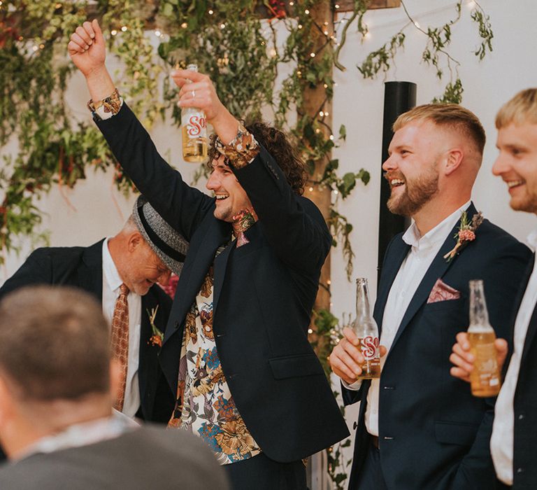 Groom celebrates on his wedding day