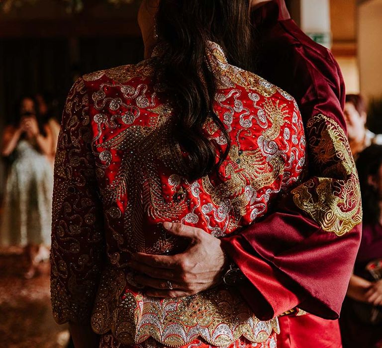 Bride and groom change into traditional Chinese wedding attire for their multicultural wedding