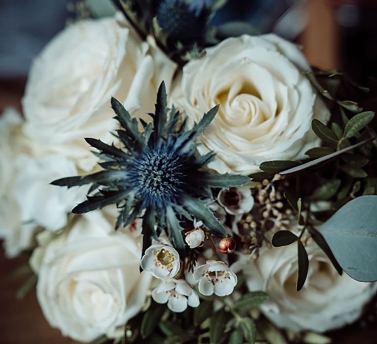 White rose wedding flowers with thistle and wax flower for Southend Barns wedding