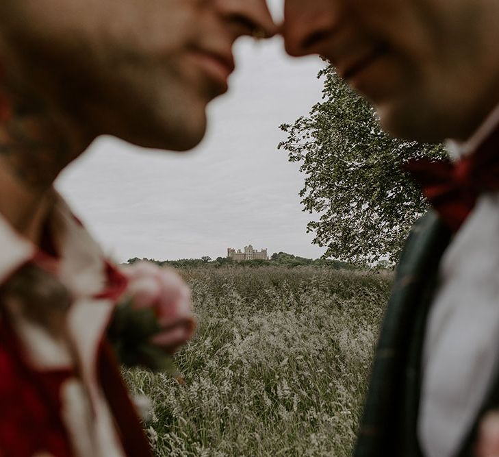 Close up of grooms outdoors on their wedding day