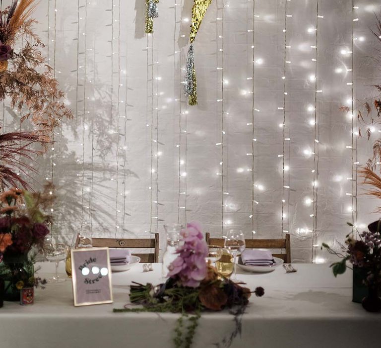 Fairy lights and sparkly lightning bolt wedding backdrop decoration 