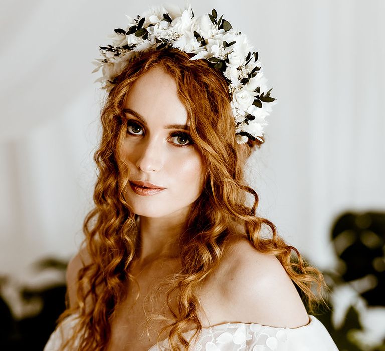 off the shoulder wedding dress with white and black dried flower crown 