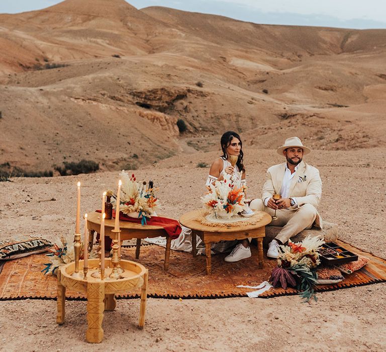 Persian rug, dried wedding flowers and table for intimate wedding breakfast for the bride and groom 