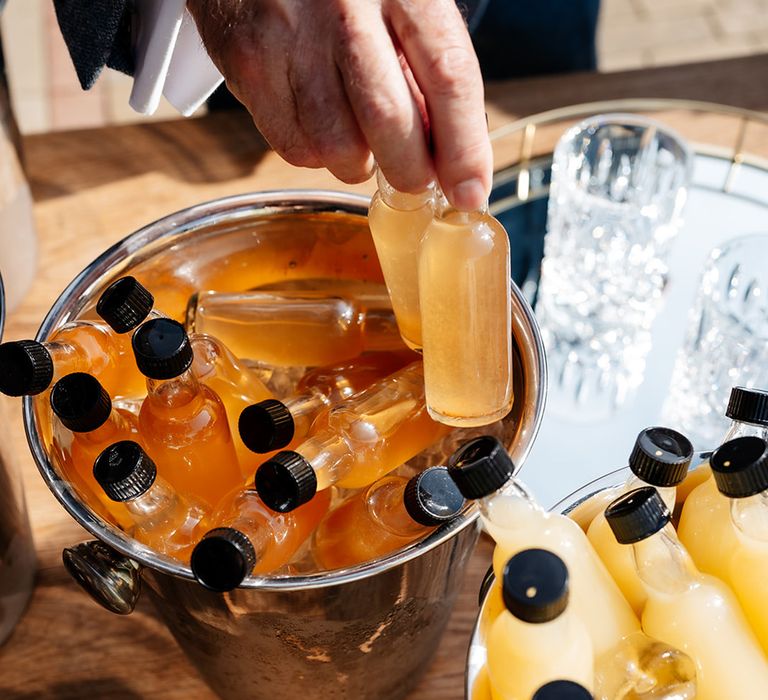 Mini bottles filled with alcohol for the wedding guests 