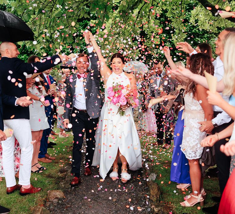 Confetti moment for the bride and grom at Ash Barton Estate wedding venue 