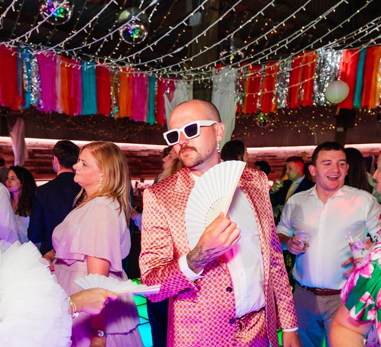 Bridesman dancing on the light up dancefloor 