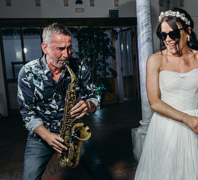 Saxophone player peforms at the wedding reception 