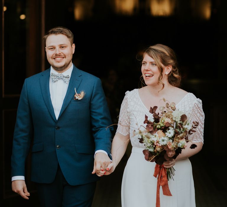 Bride and groom exiting the church as husband and wife 