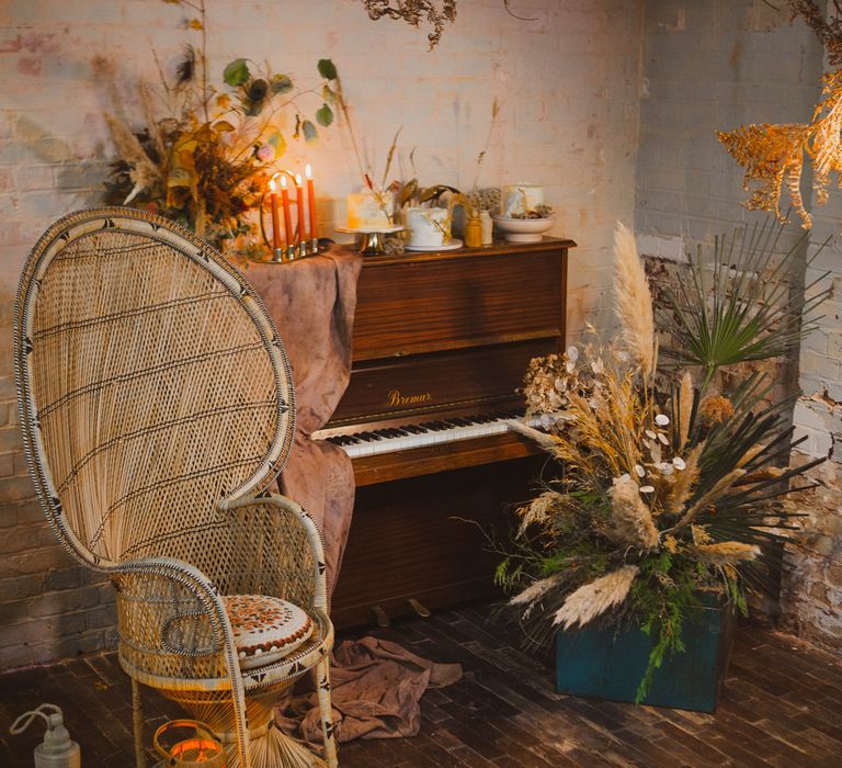 Wedding cake and deserts presented on top of a piano for earthy wedding ideas