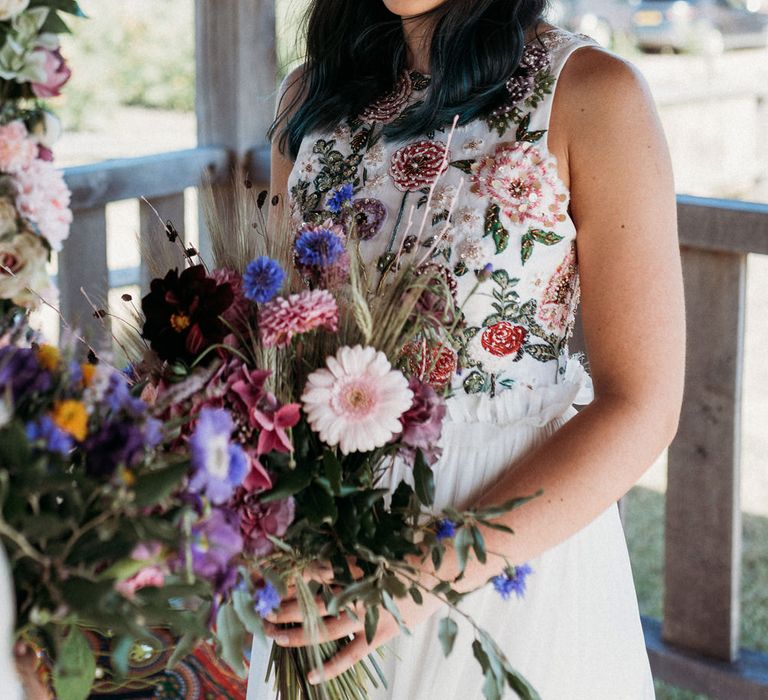 Bride in a flower embroidered wedding dress 