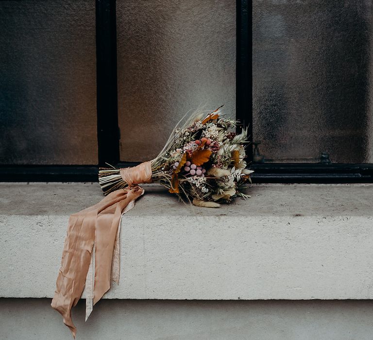 Dried flower wedding bouquet tied with ribbon 