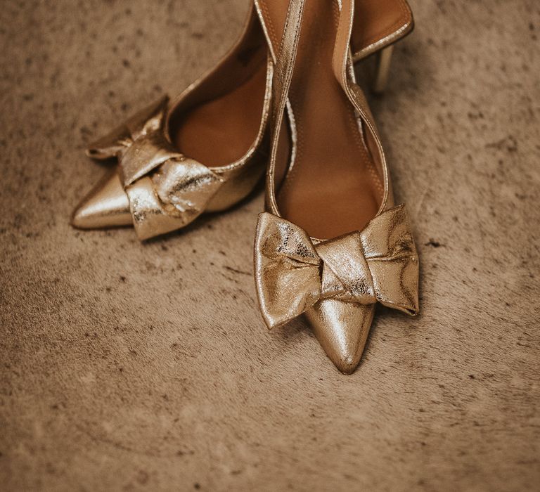 Gold bow slingback heels