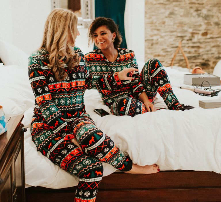 Bridesmaids on the wedding morning in matching green and red Christmas pyjamas