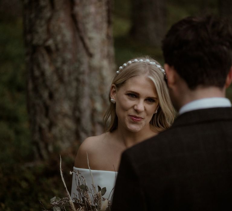 Bride smiles during ceremony in Scotland