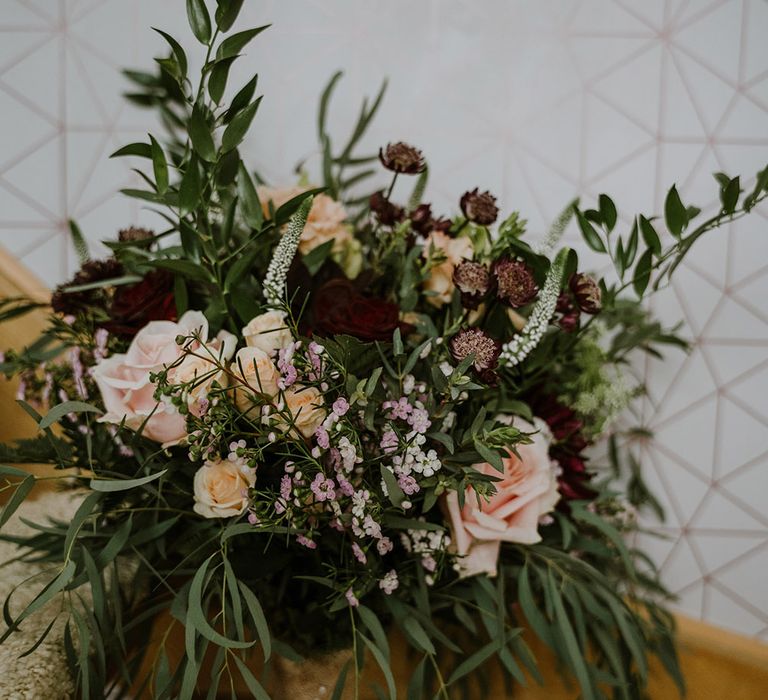 Wildflower wedding bouquet with foliage and roses 