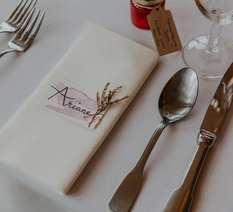 Water colour name place card and napkin at place setting 