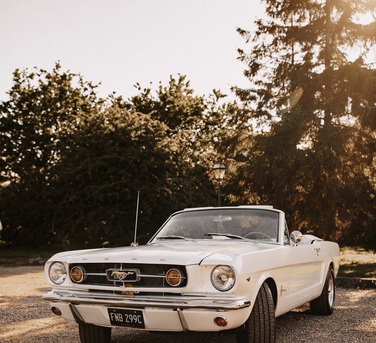 Convertible white mustang wedding car 