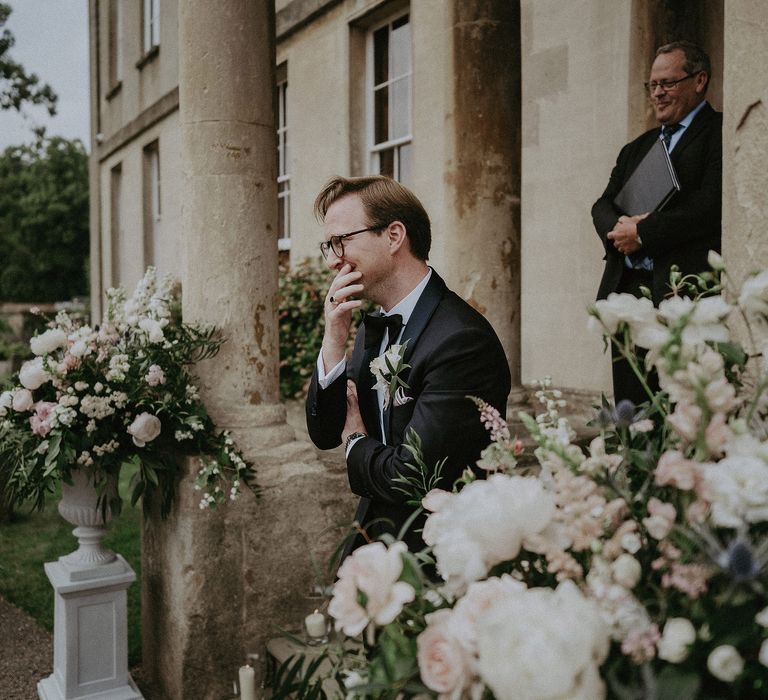 Groom sees bride for the first time on the day of his wedding at Elmore Court