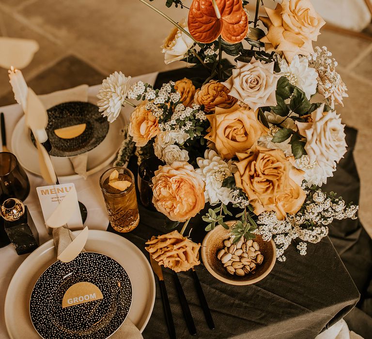 peeled back orange and yellow rose wedding table flowers 