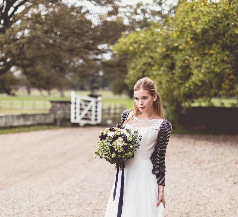 Bride in a short black sequin bridal coverup 