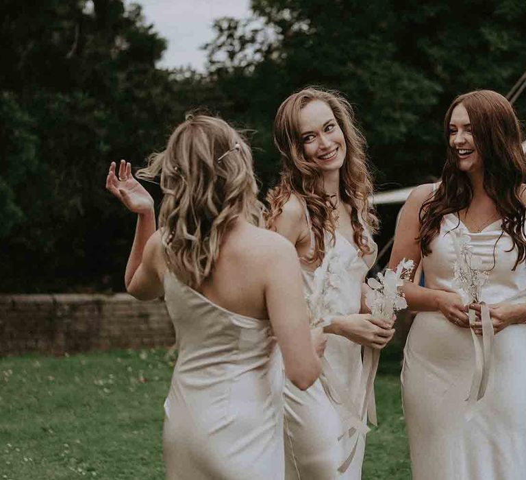 Champagne bridesmaid dresses with neutral bouquets