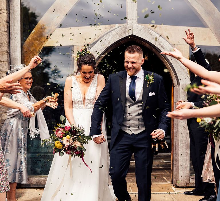 Confetti moment for bride and groom at Cripps Barn