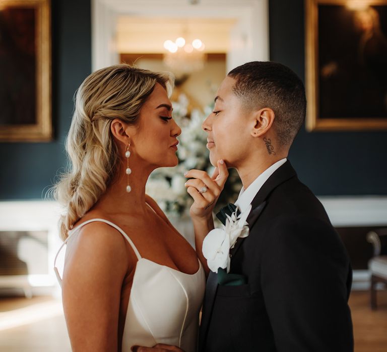 Luxury LGBTQI+ wedding at Hodsock Priory with princes wedding dress and tuxedo 