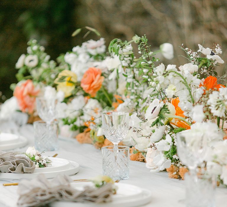 crystal glassware at romantic outdoor tablescape 