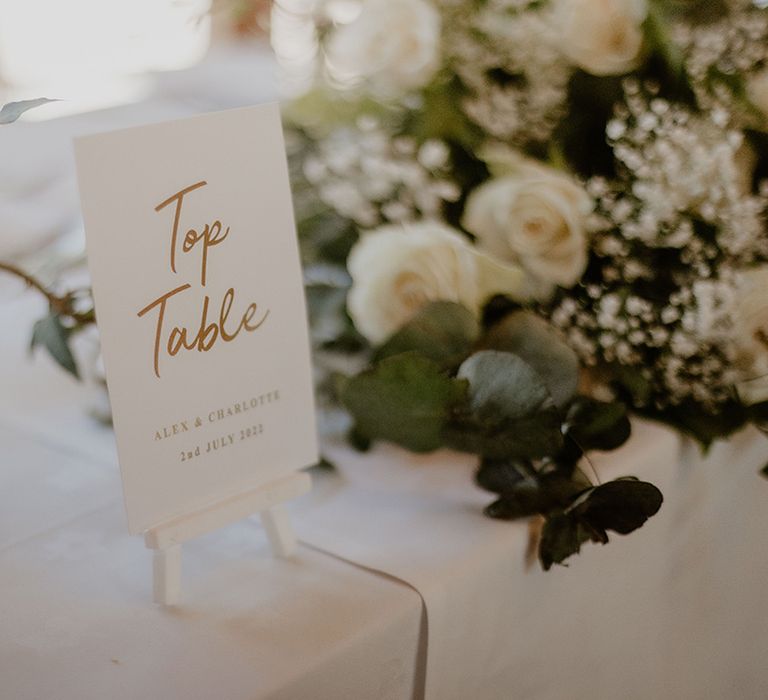 White and gold wedding table sign 