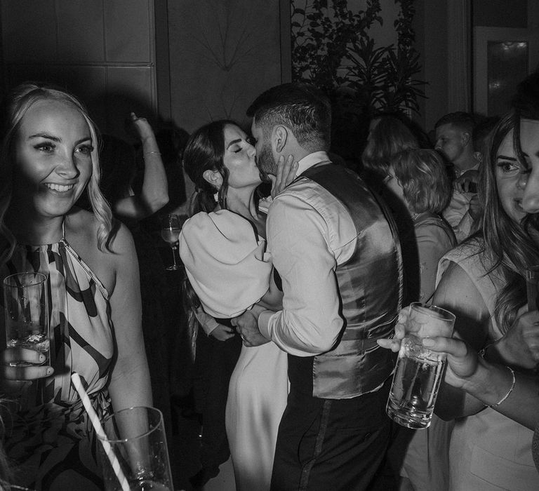 Bride and groom sharing a kiss on the dance floor at Somerset House wedding