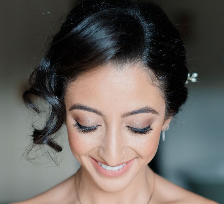 Bride wears natural styled makeup complete with neutral toned eyeshadow 