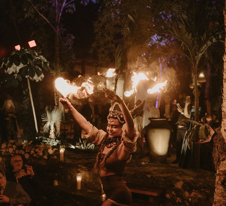 Fire dancers outdoors in Mexico Tulum for rave wedding 