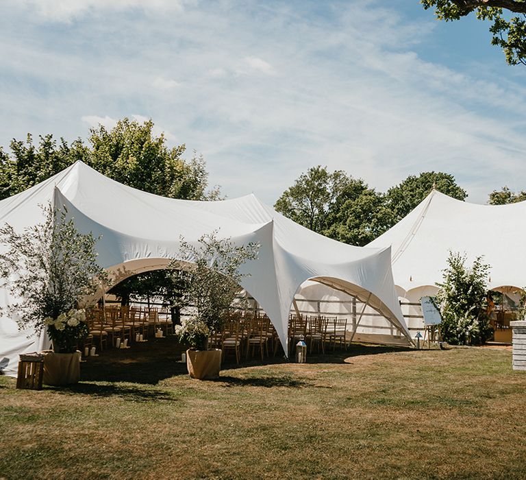 Outdoor ceremony tent for back garden wedding with classic styling 