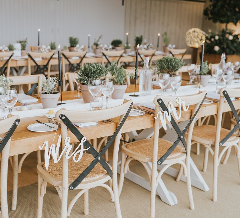 Mr and Mrs white wedding laser cut signs for the wedding chair decor on rattan wedding chairs 