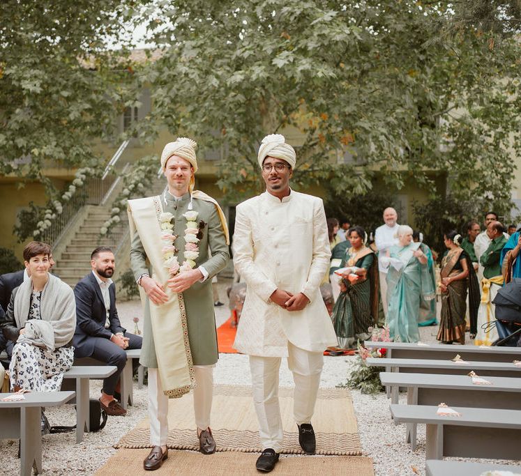 Groom and bestman in cream and green Sherwani and Churidar outfits