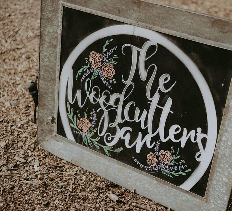 Chalkboard wedding signage directing guests to the bar 