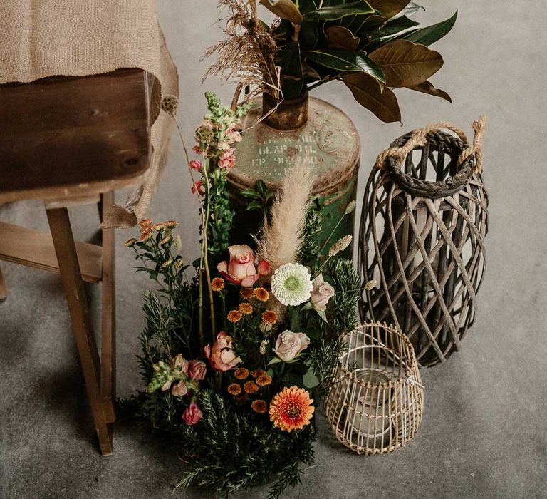 Rattan vases with foliage, garden rose, pampas grass and dried flower boho flower arrangements at The Barn at Avington