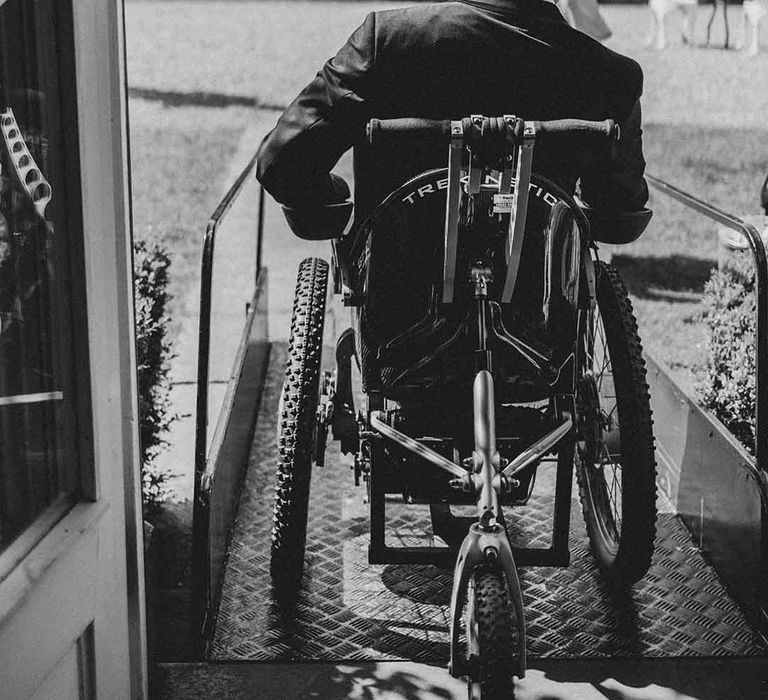 disabled groom in a wheelchair using a ramp at accessible wedding venue in Cheshire 