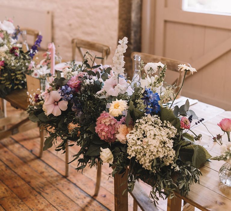 Pink, blue and white wedding flower table arrangements for a botanical and boho Lancashire wedding 