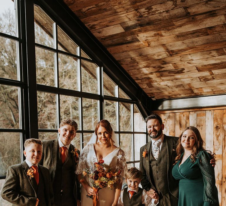 Bride and groom with their close family and friends for stunning wedding portrait and photo 