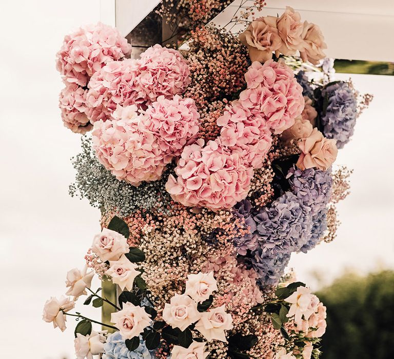 Pink, blue, and white roses, gypsophila, hydrangeas and more 