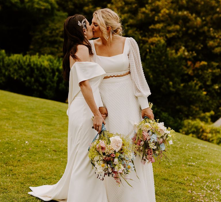 Dorset wedding with two brides at a classic wedding with pastel wildflower bouquets at Pennsylvania Castle Estate 