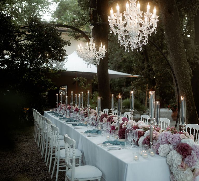 Pastel theme wedding tablescape at outdoor Tuscany wedding with wedding flower table runner