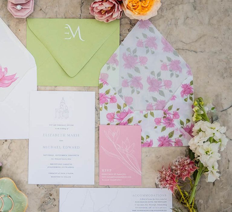 Pale pink and lime green wedding stationery suite with floral designs 