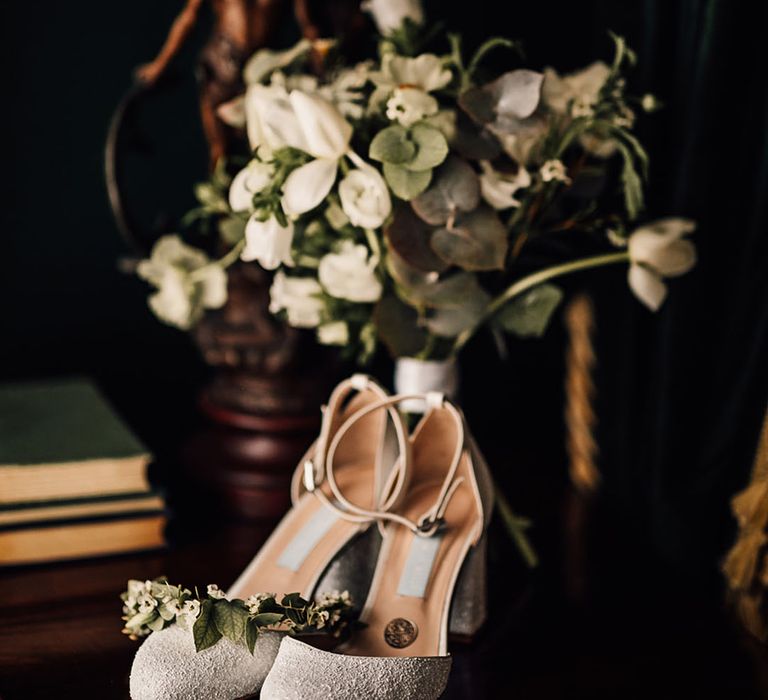 Sparkly Charlotte Mills wedding shoes with white flower bouquet 