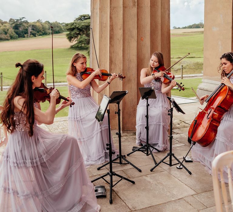 String quartet playing at wedding ceremony 