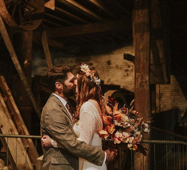 Couple portrait of the bride and groom wearing boho outfits for their industrial style wedding in Yorkshire 