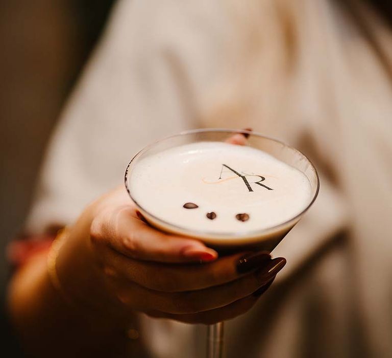 Personalised edible cocktail topper with the wedding logo for espresso martini 