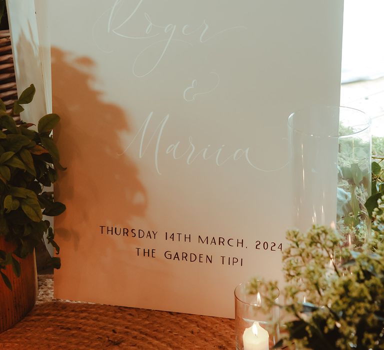 Ivory arched wedding welcome signage with wedding date 